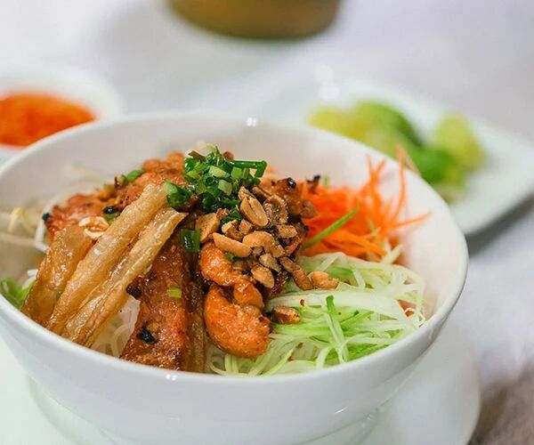Capture the smoky allure of Hanoi’s iconic dish